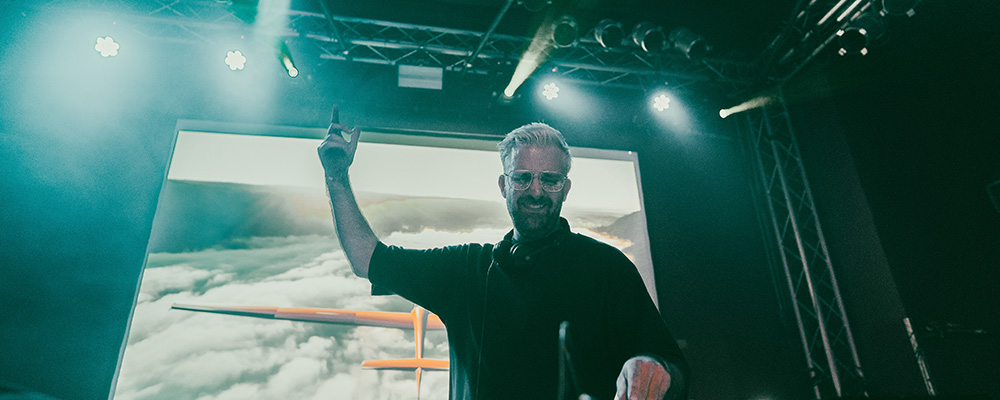 A press picture showing DJ Steve Clash performing